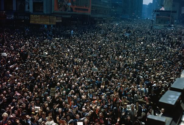 Crowds celebrate over Germany's surrender.