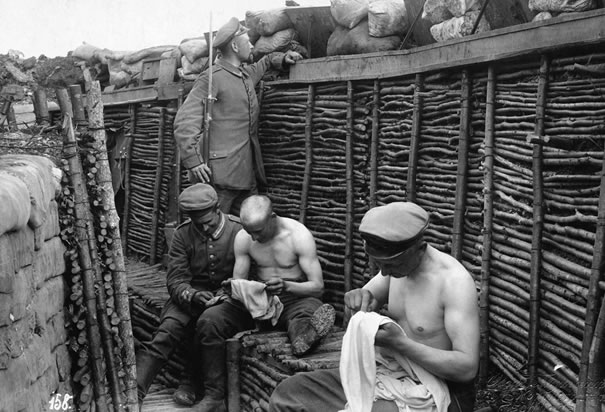 World War I: Trench Warfare. Soldiers Picking Lice from Clothes